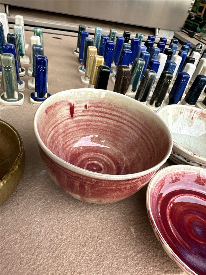 Finished pottery pieces staged for pickup